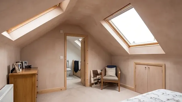 Finished loft conversion bedroom with a Velux rooflight window