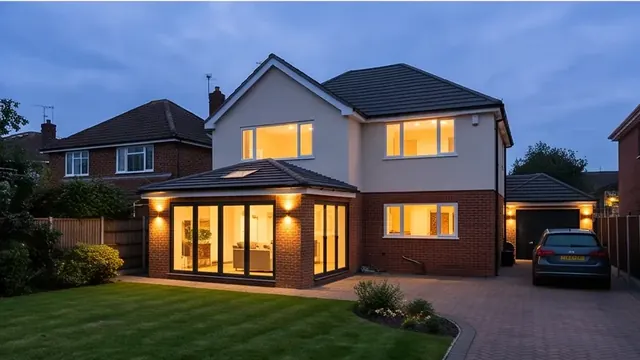 Finished house exterior at dusk with warm interior lighting at a semi-rural detached home