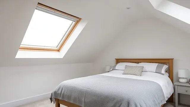 Finished loft conversion bedroom with a Velux rooflight window