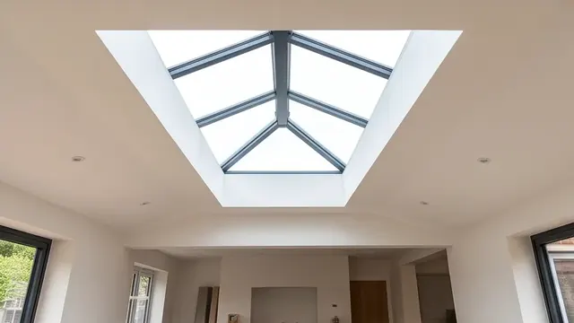 Vaulted ceiling with exposed roof lantern flooding an open-plan extension with light