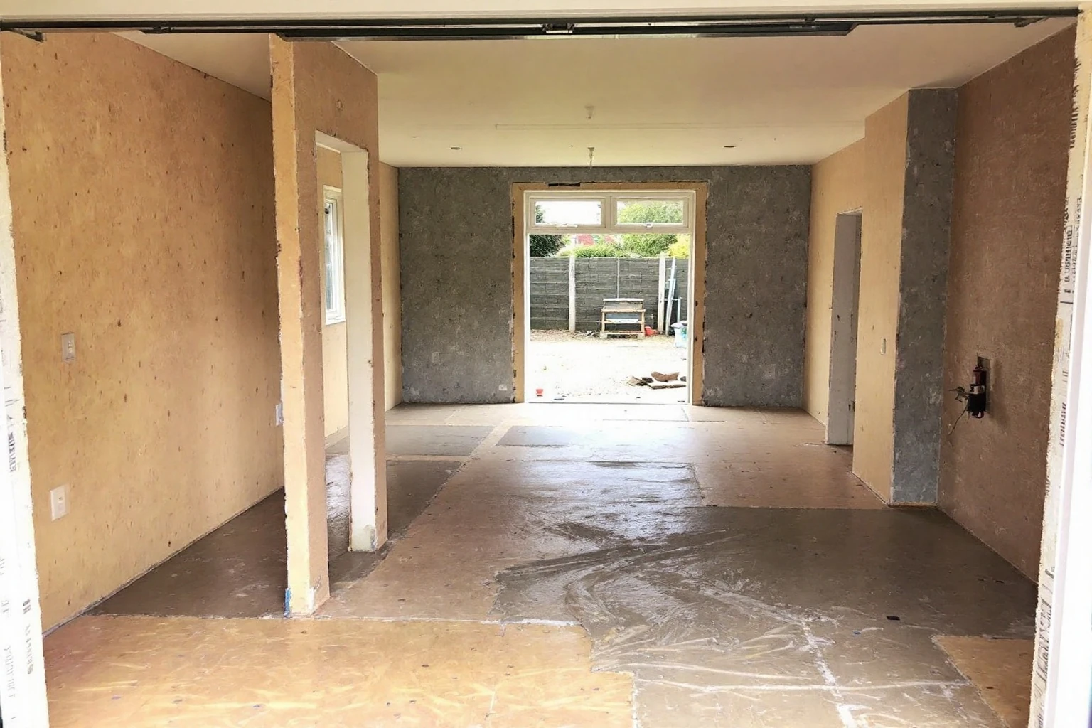 Insulated floor screed and wall boarding — garage conversion Wokingham