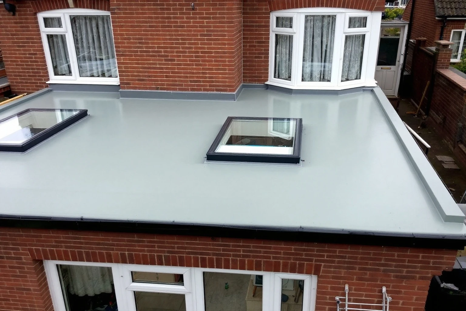 Flat GRP roof structure and Velux rooflights installed — Bracknell extension